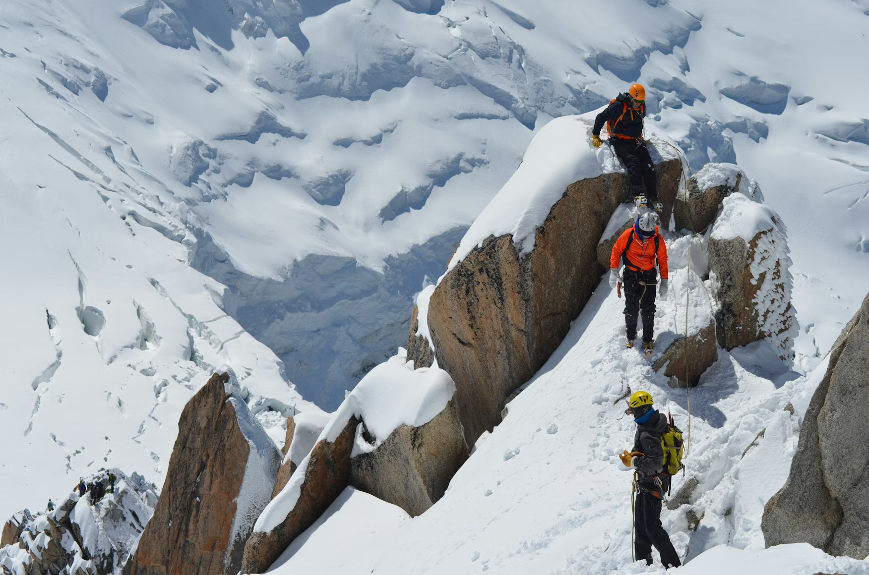Team of climbers roped together on a glacier
