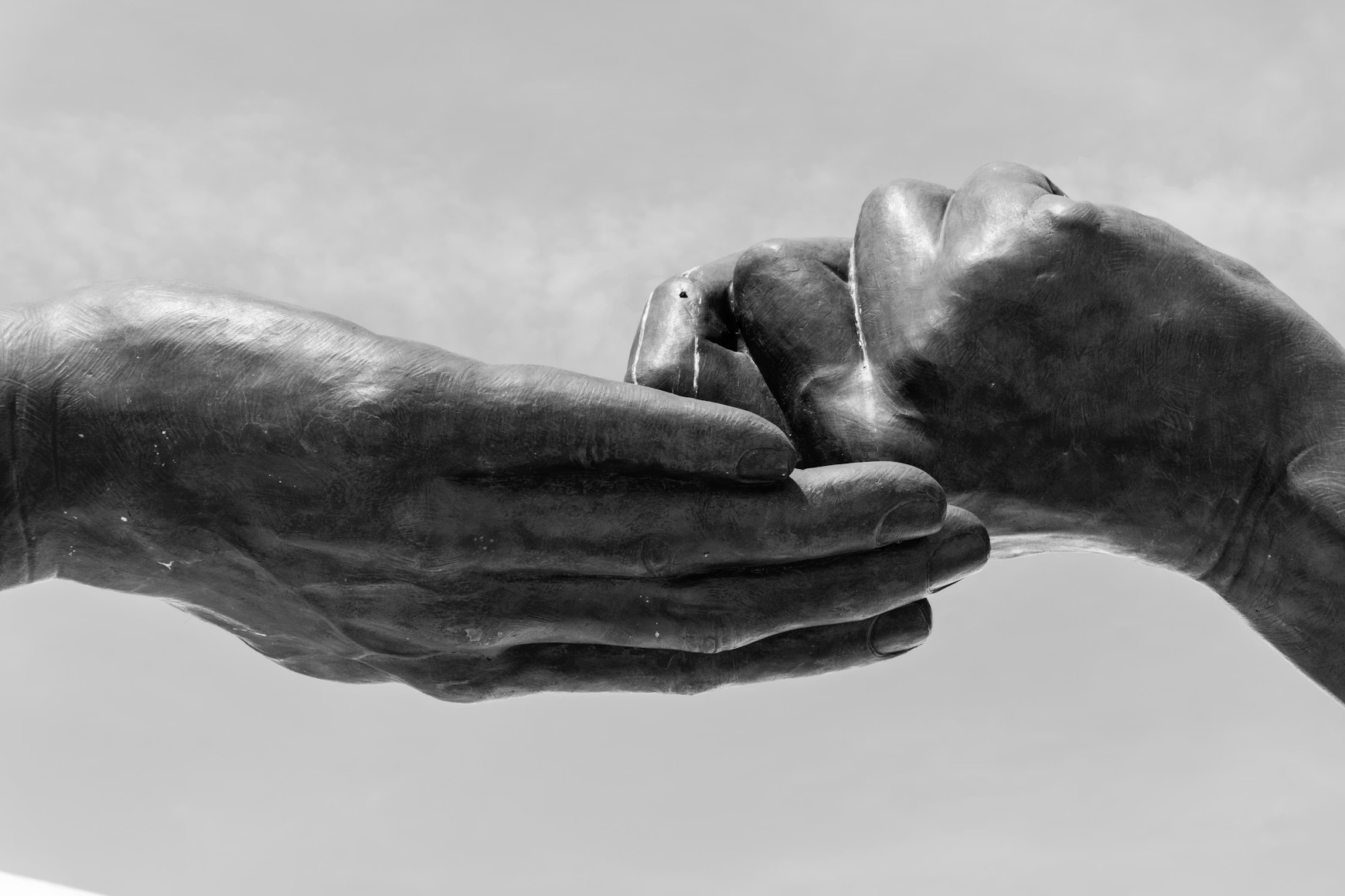 Two hands supporting each other, symbolizing shared responsibility